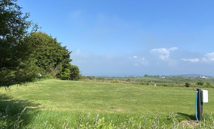 Stunning views from some of our grass pitches - looking onto Snowdonia and Cardigan Bay
